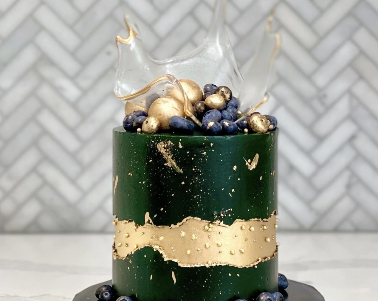 Elegant green and gold celebration cake