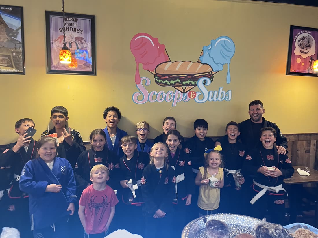 Young martial artists celebrating at Scoops & Subs
